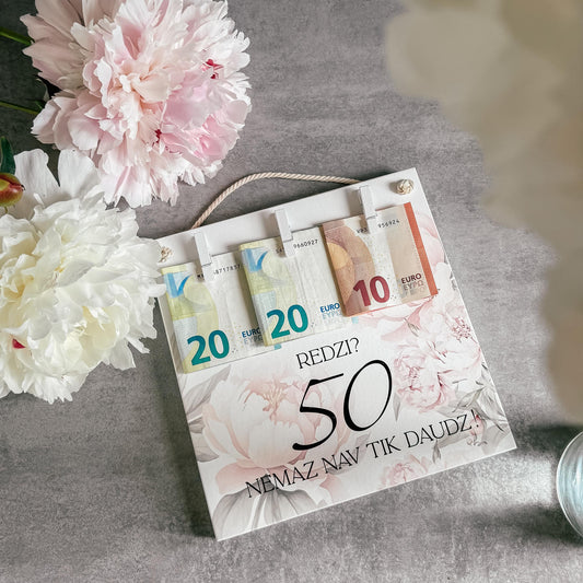 DEKORS NAUDAS PASNIEGŠANAI "REDZI? NEMAZ NAV TIK DAUDZ!" AR MAIGIEM ZIEDIEM