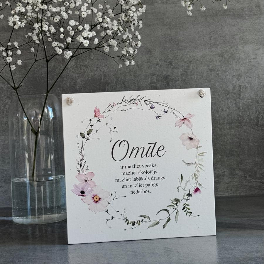 "OMĪTE" MAIGS DIZAINS AR ZIEDU VAINAGU