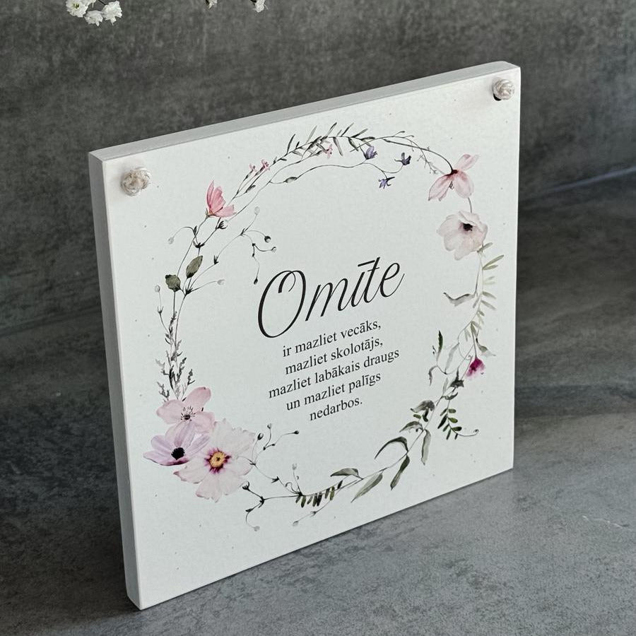 "OMĪTE" MAIGS DIZAINS AR ZIEDU VAINAGU
